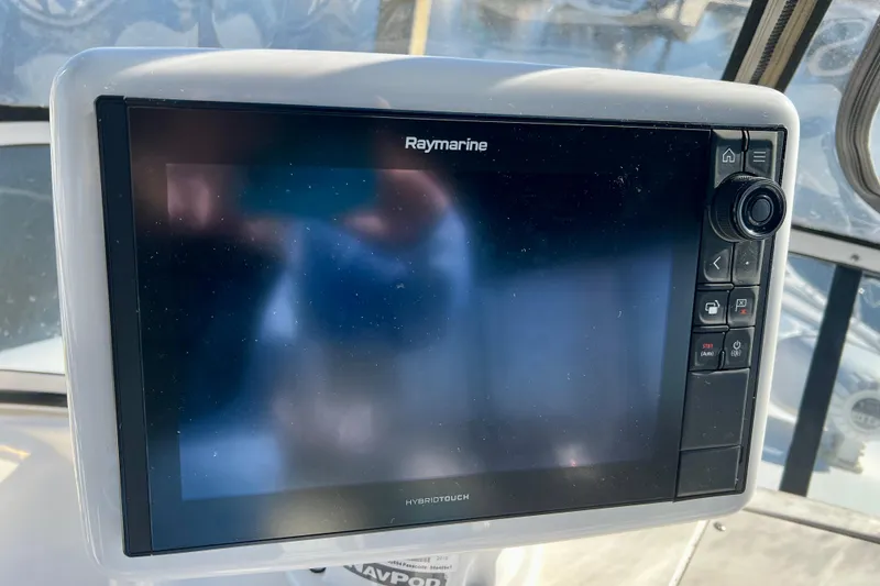 Slide: The Image of Raymarine navigation system on 2003 Silverton 43 Motor Yacht dashboard. - 13