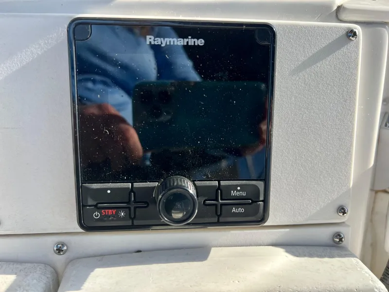 Slide: The Image of Raymarine control panel on 2003 Silverton 43 Motor Yacht dashboard. - 15