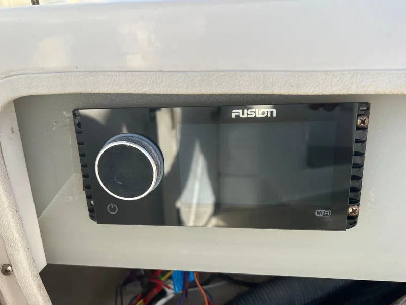 Slide: The Image of Fusion audio system on 2003 Silverton 43 Motor Yacht dashboard. - 16