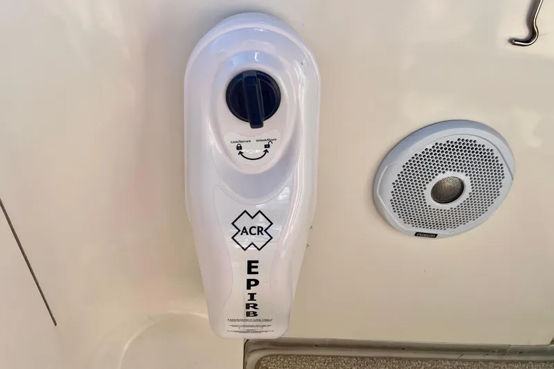 Slide: The Image of ACR EPIRB mounted on 2003 Silverton 43 Motor Yacht, next to a speaker. - 17