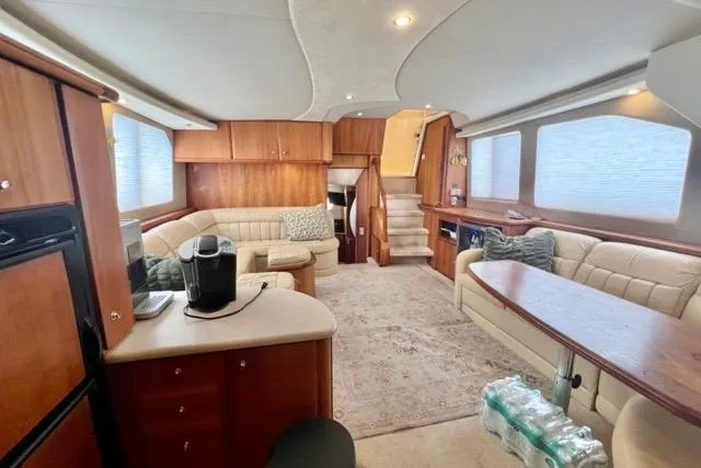Slide: The Image of Luxurious interior of a 2003 Silverton 43 Motor Yacht with elegant seating and modern amenities. - 25