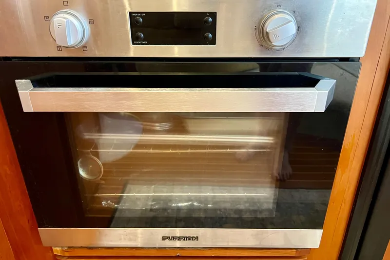 Slide: The Image of Stainless steel oven in a 2003 Silverton 43 Motor Yacht kitchen. - 28