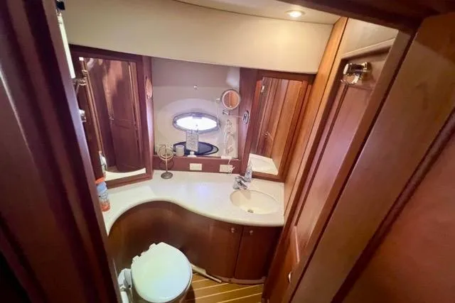 Slide: The Image of Luxurious bathroom in 2003 Silverton 43 Motor Yacht with wood cabinetry and modern fixtures. - 31