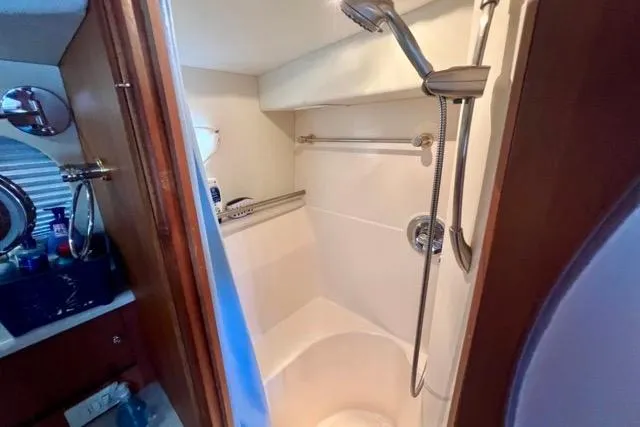 Slide: The Image of 2003 Silverton 43 Motor Yacht bathroom with shower and vanity area. - 39