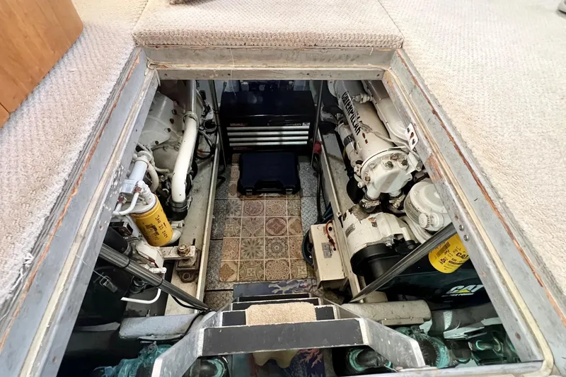 Slide: The Image of Engine room of 2003 Silverton 43 Motor Yacht, showcasing mechanical components and equipment. - 41