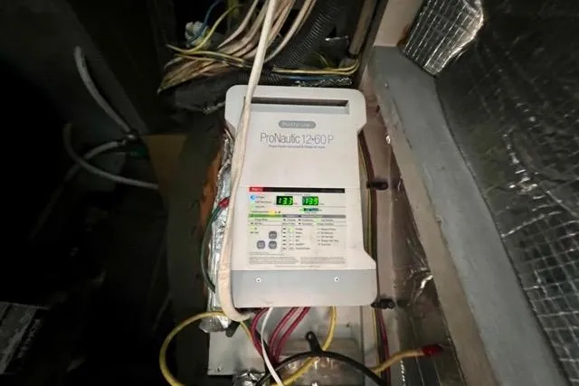 Slide: The Image of Battery charger in a 2003 Silverton 43 Motor Yacht engine room. - 44