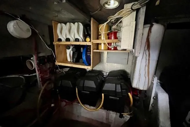 Slide: The Image of Engine room of 2003 Silverton 43 Motor Yacht with storage shelves and equipment. - 46