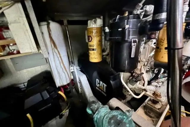 Slide: The Image of Engine room of a 2003 Silverton 43 Motor Yacht with visible CAT components. - 48