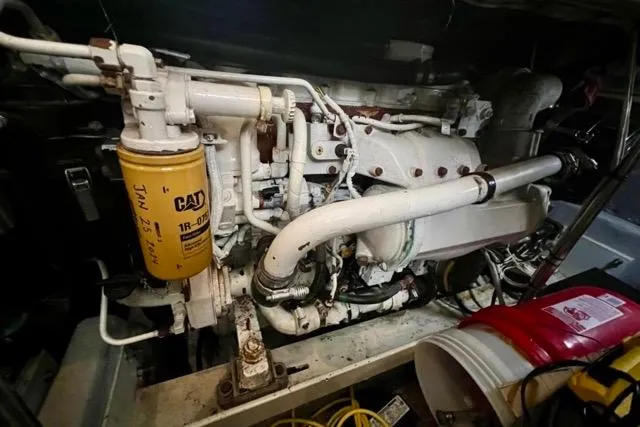 Slide: The Image of Engine room of a 2003 Silverton 43 Motor Yacht with CAT components visible. - 49