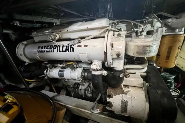 Slide: The Image of Engine room of a 2003 Silverton 43 Motor Yacht featuring a Caterpillar engine. - 50