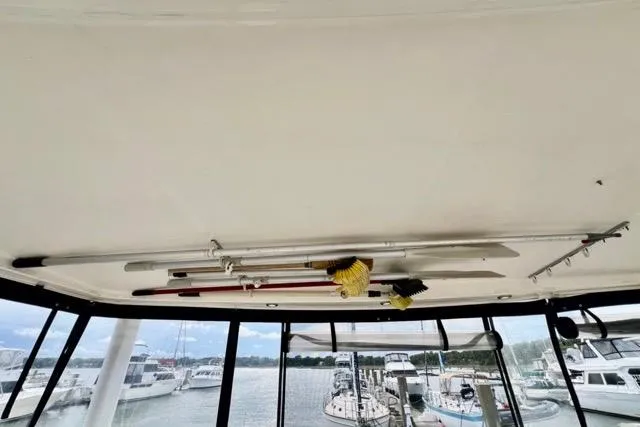 Slide: The Image of Ceiling view of 2003 Silverton 43 Motor Yacht with cleaning tools stored overhead. - 6
