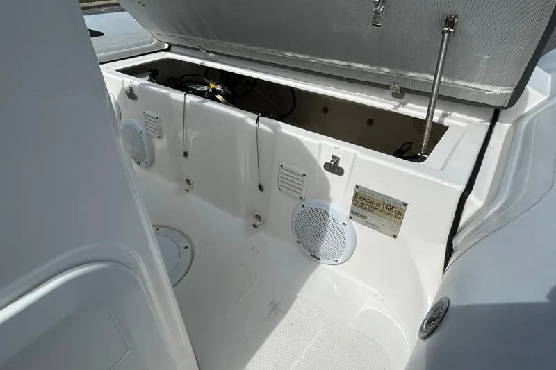 Slide: The Image of 2016 Brig Navigator 520 boat interior with open storage compartment and speaker. - 12