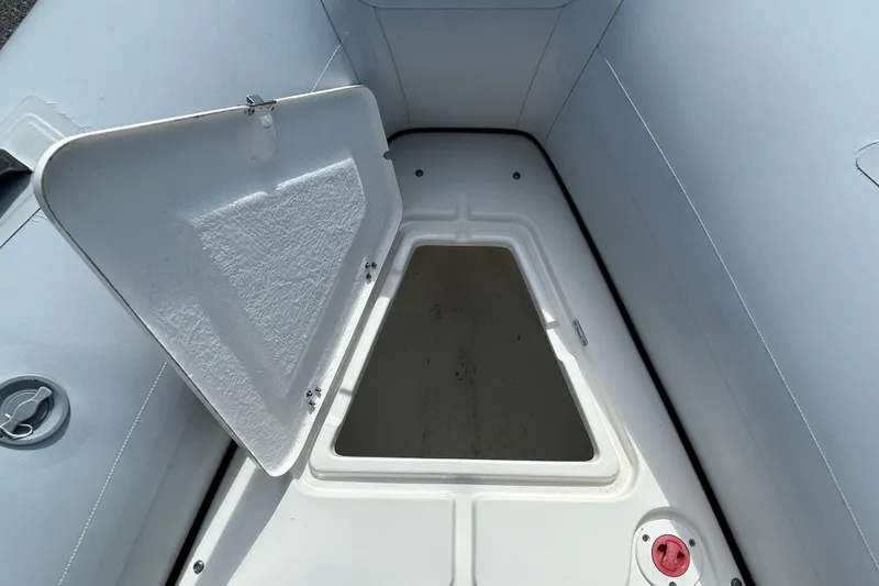 Slide: The Image of Open storage compartment on 2016 Brig Navigator 520 boat. - 18