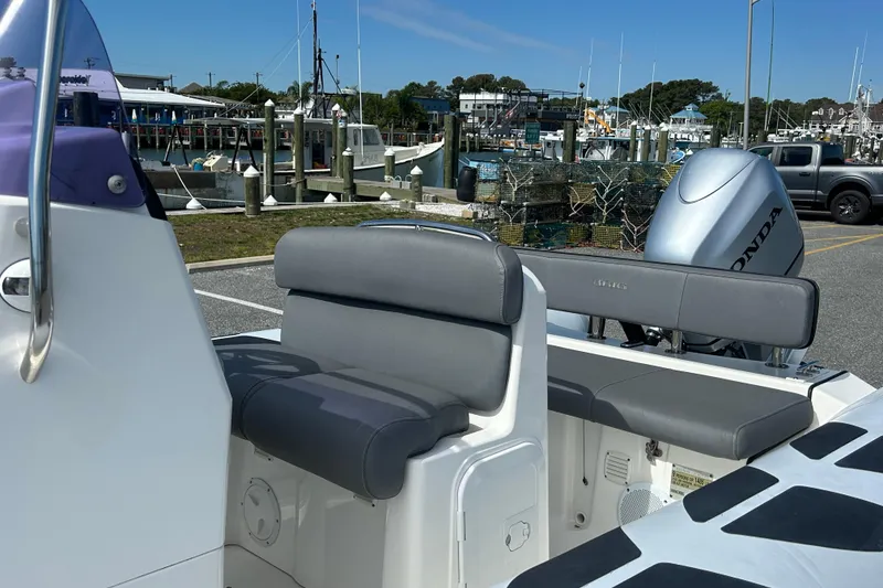Slide: The Image of 2016 Brig Navigator 520 boat with Honda outboard motor, docked at marina. - 9