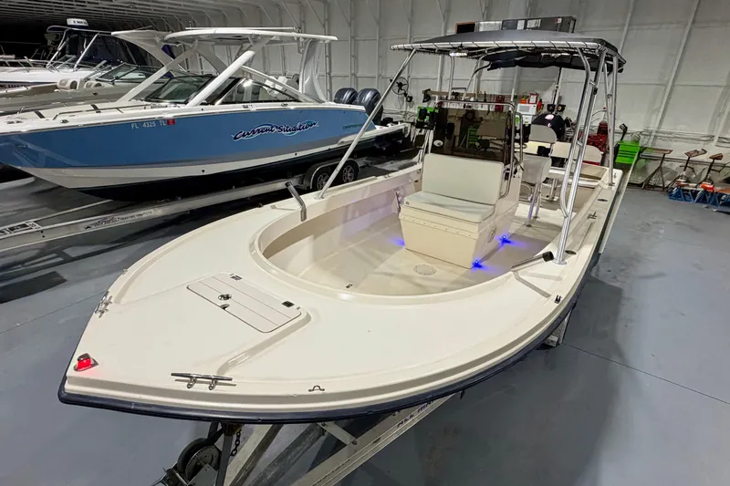 Slide: The Image of 2002 Parker 2100 Special Edition boat in showroom, featuring sleek design and modern amenities. - 10