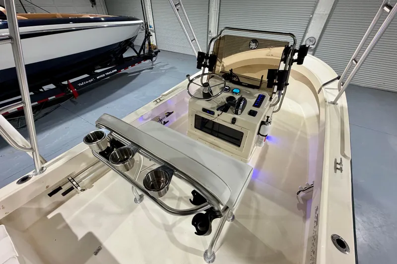 Slide: The Image of 2002 Parker 2100 Special Edition boat interior with steering console and cup holders. - 12