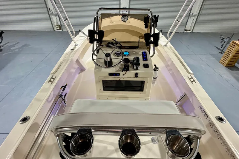 Slide: The Image of Interior view of a 2002 Parker 2100 Special Edition boat, showcasing the helm and controls. - 13