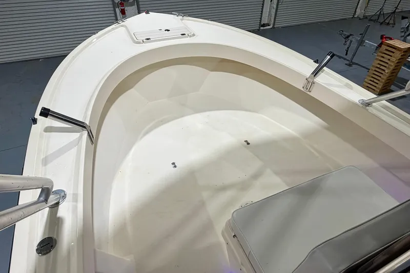 Slide: The Image of 2002 Parker 2100 Special Edition boat interior with seating and storage compartments. - 17