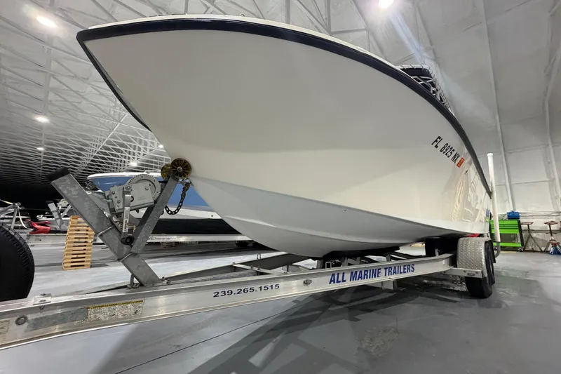Slide: The Image of 2002 Parker 2100 Special Edition boat on trailer in indoor storage facility. - 20