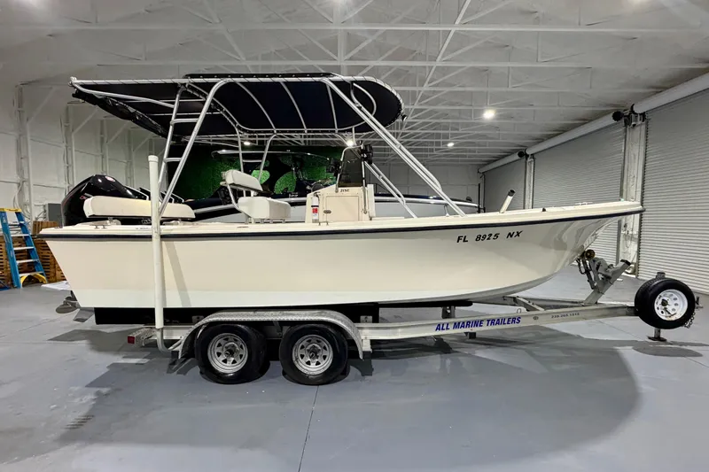 Slide: The Image of 2002 Parker 2100 Special Edition boat on trailer in indoor storage facility. - 3