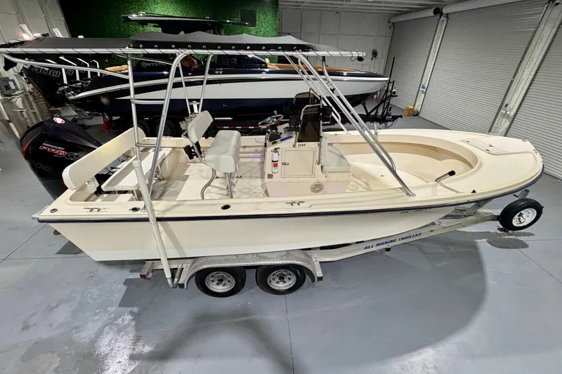 Slide: The Image of 2002 Parker 2100 Special Edition boat on trailer in indoor storage. - 7