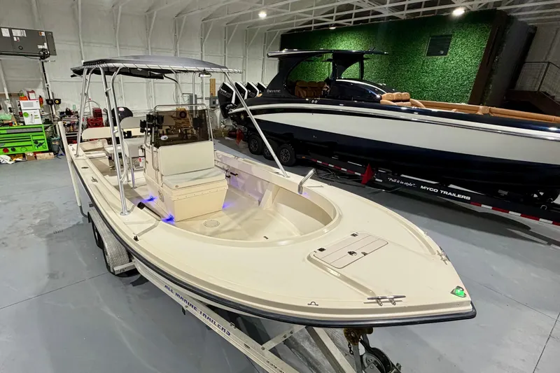 Slide: The Image of 2002 Parker 2100 Special Edition boat in a showroom, on a trailer. - 8