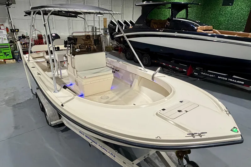 Slide: The Image of 2002 Parker 2100 Special Edition boat on trailer in indoor showroom. - 9