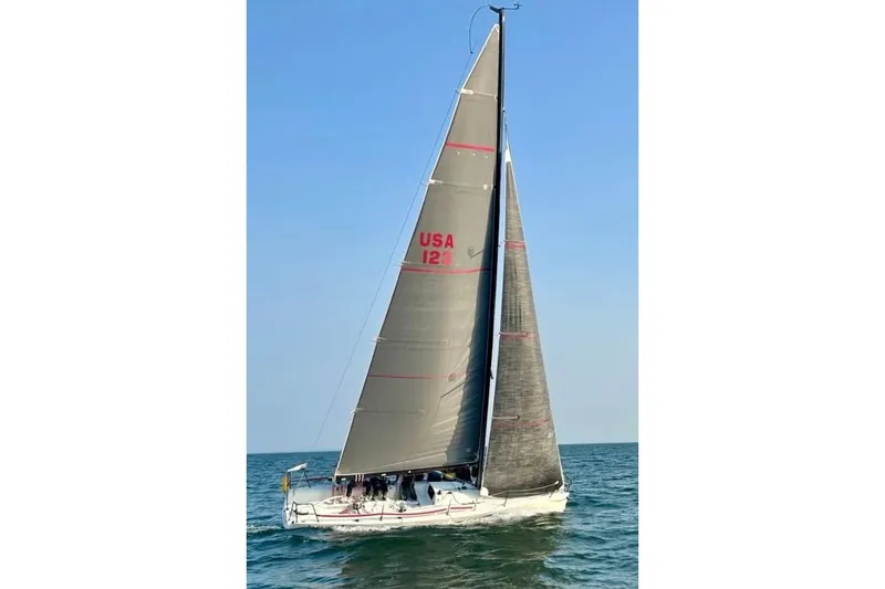 Slide: The Image of Sailing on open water, a 2005 Melges 32 yacht with full sails. - 8