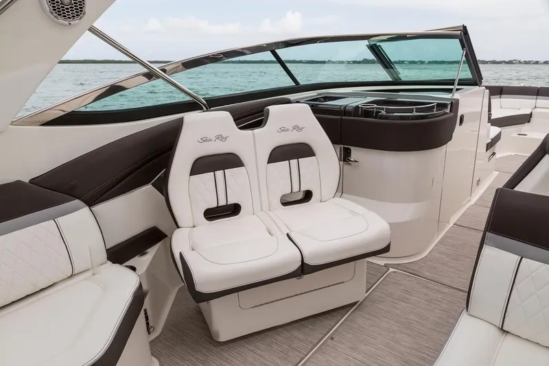 Slide: The Image of Manufacturer Provided Image: 2019 Sea Ray SLX 350 OB boat interior with luxurious seating and ocean view. - 10