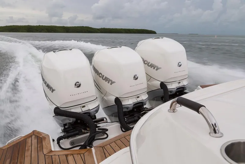 Slide: The Image of Manufacturer Provided Image: 2019 Sea Ray SLX 350 OB with triple Mercury outboard engines on the water. - 16