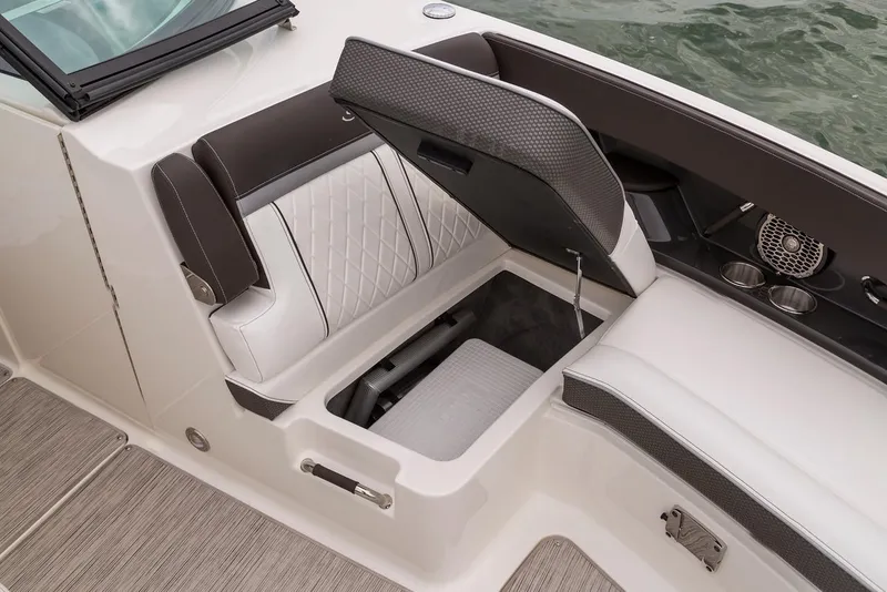 Slide: The Image of Manufacturer Provided Image: 2019 Sea Ray SLX 350 OB boat with open storage compartment and cushioned seating. - 8
