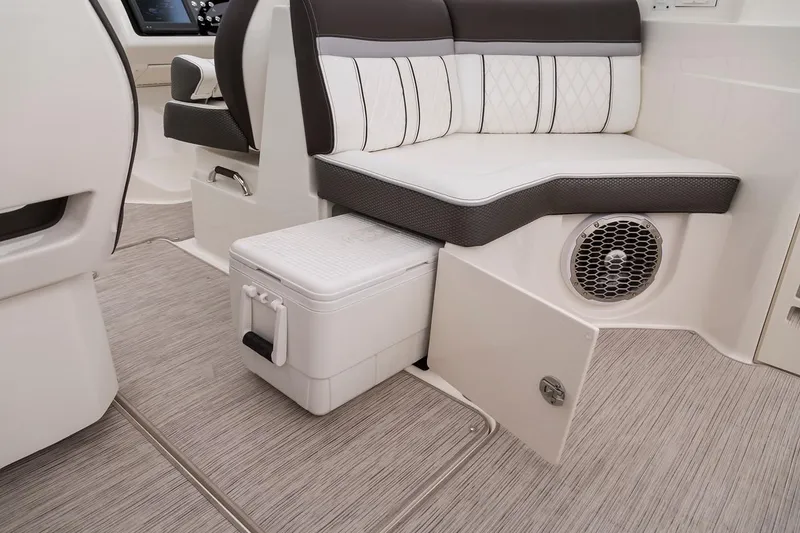 Slide: The Image of Manufacturer Provided Image: 2019 Sea Ray SLX 350 OB interior seating with storage and speaker. - 11