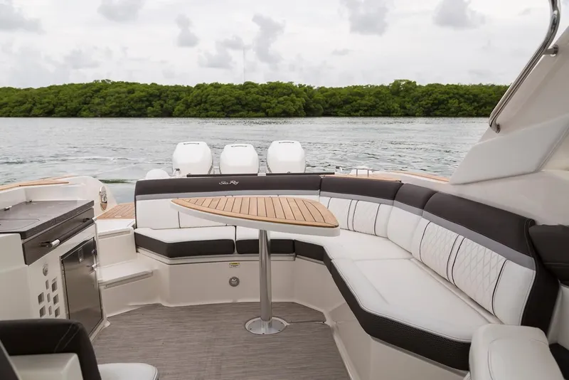 Slide: The Image of Manufacturer Provided Image: 2019 Sea Ray SLX 350 OB boat interior with seating and table. - 13
