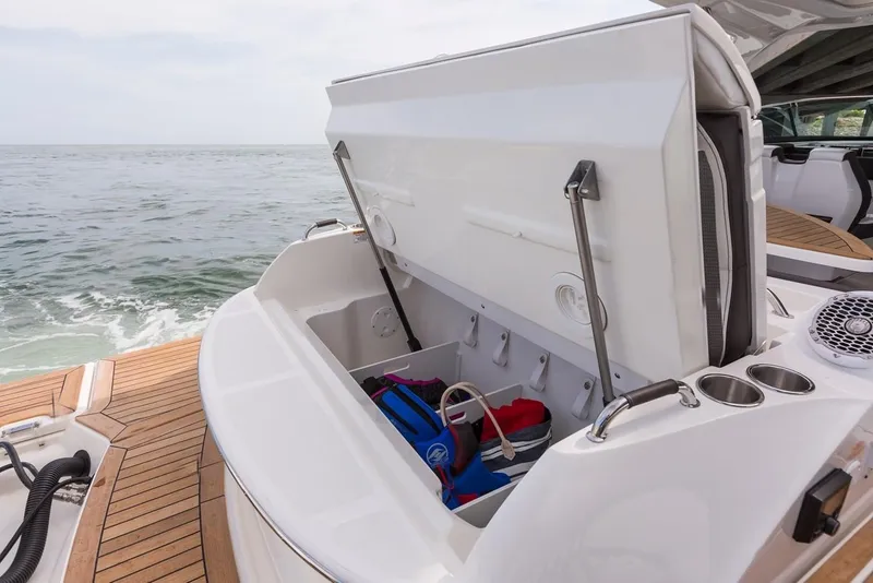 Slide: The Image of Manufacturer Provided Image: 2019 Sea Ray SLX 350 OB boat with open storage compartment on deck. - 14