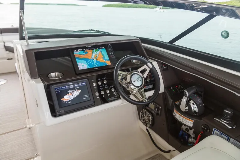 Slide: The Image of Manufacturer Provided Image: 2019 Sea Ray SLX 350 OB helm with navigation screens and controls. - 9