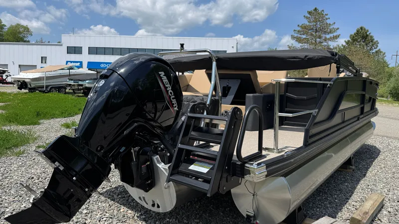 Slide: The Image of Evotti 521CS 2026 pontoon boat with Mercury engine outdoors. - 3