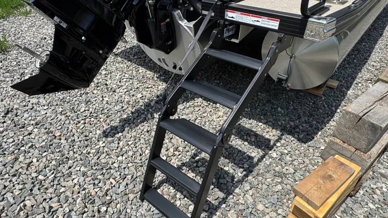 Slide: The Image of Evotti 521CS 2026 boat with ladder on gravel. - 4