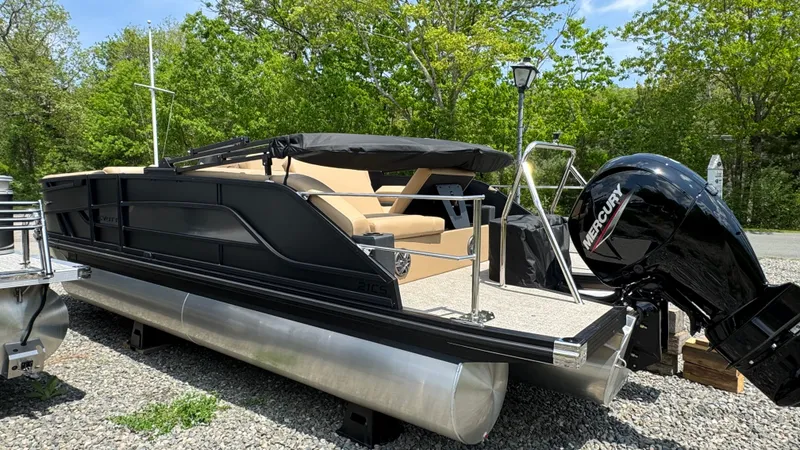 Slide: The Image of Evotti 521CS 2026 pontoon boat with Mercury engine parked outdoors. - 5
