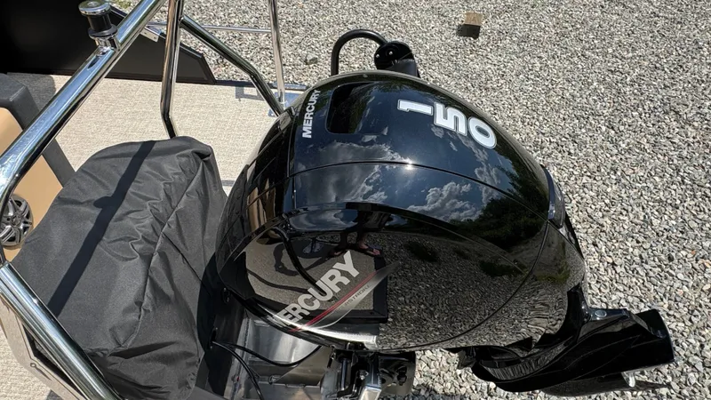 Slide: The Image of Evotti 521CS 2026 with Mercury outboard motor on gravel surface. - 6