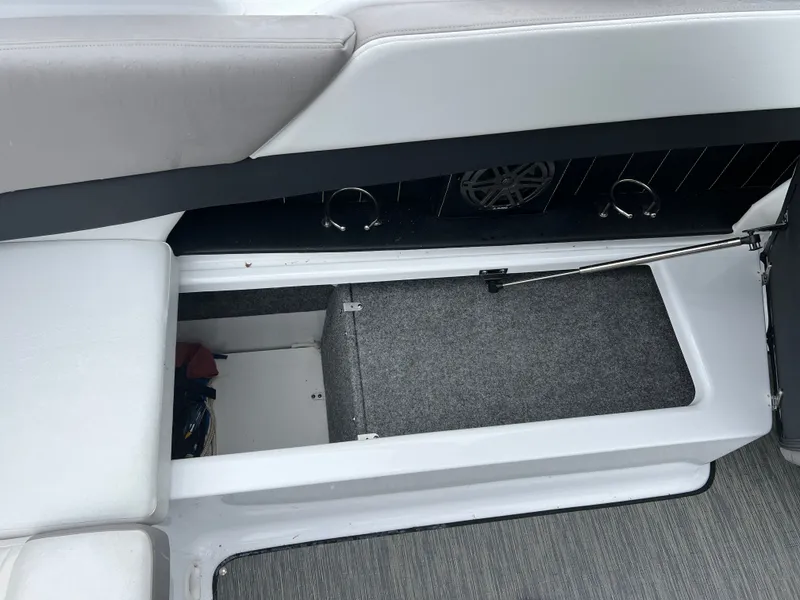Slide: The Image of Interior of 2022 Four Winns H260 boat with storage compartment. - 11