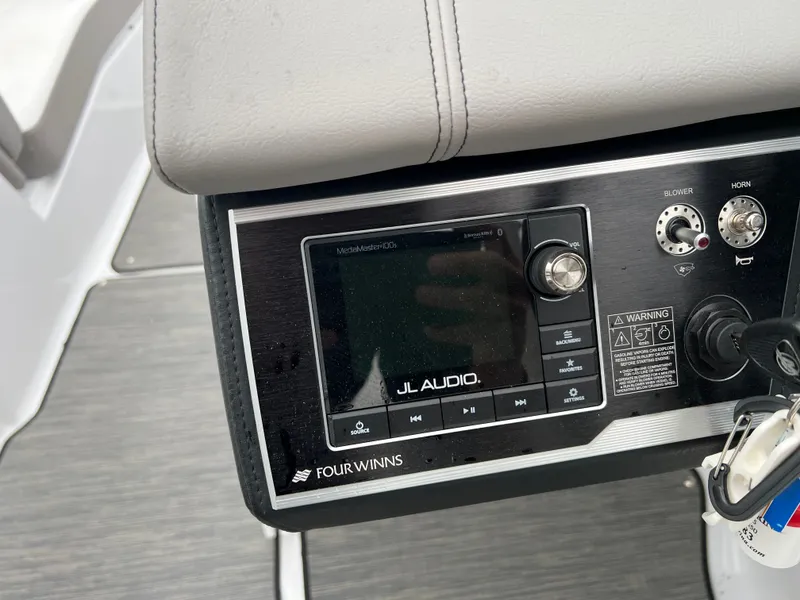 Slide: The Image of JL Audio control panel on a 2022 Four Winns H260 boat. - 13