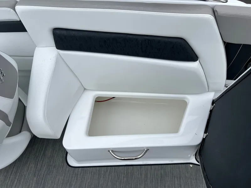 Slide: The Image of Interior of Four Winns H260 boat, seat with storage compartment. - 17