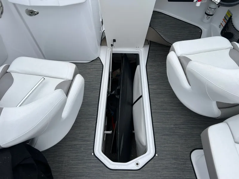Slide: The Image of Interior of Four Winns H260 boat with storage compartment. - 20