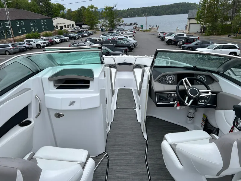 Slide: The Image of Interior view of a 2022 Four Winns H260 boat by the lake. - 22