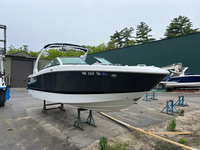 Slide: The Image of 2022 Four Winns H260 boat on a dry dock. - 4
