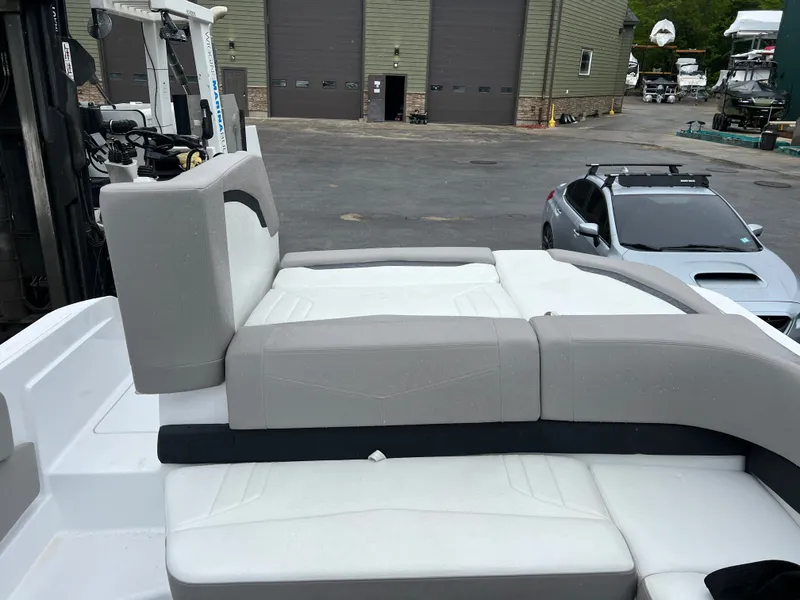 Slide: The Image of 2022 Four Winns H260 boat with sunbed at marina. - 7