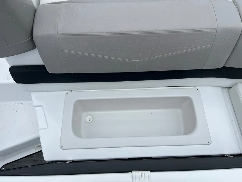 Slide: The Image of 2022 Four Winns H260 boat with storage compartment under seat. - 8