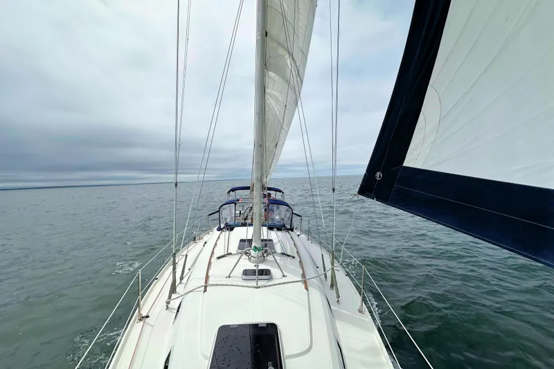 Slide: The Image of Sailing on a 1993 Ericson 38-200 yacht under cloudy skies. - 11