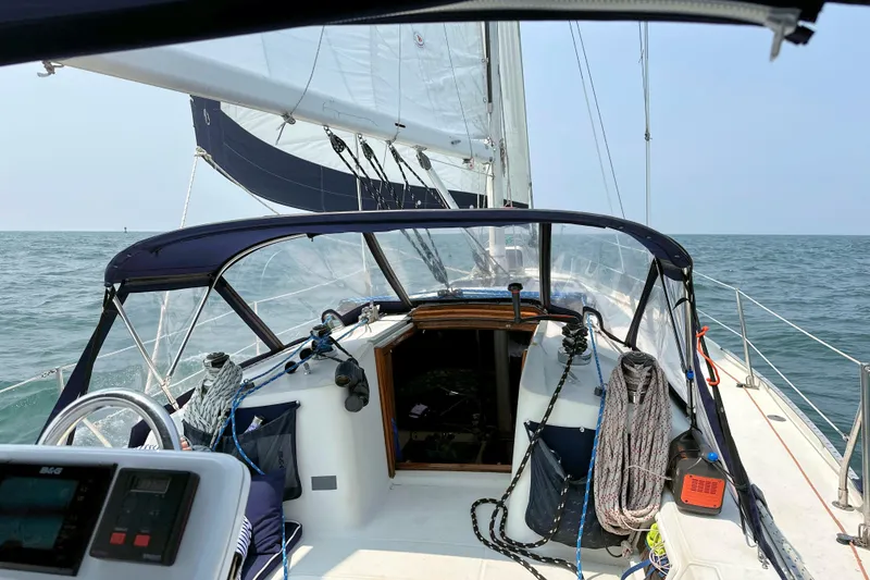 Slide: The Image of Sailing on a 1993 Ericson 38-200 yacht with open sea view and rigging details. - 15