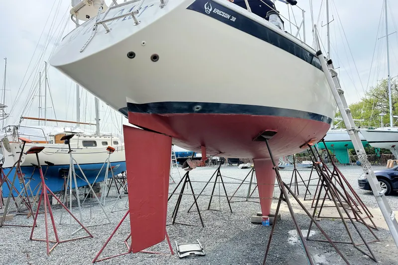 Slide: The Image of Ericson 380 sailboat from 1991 on stands in a boatyard. - 22